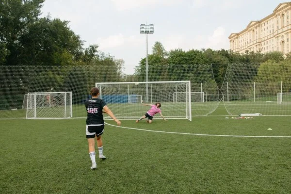 female football striker shooting